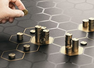 Man moving coins and stacking them on glowing hexagons