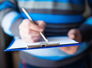 Patient filling out a dental insurance form