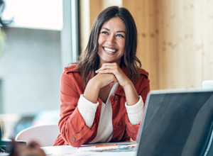 Woman smiling during meeting in office