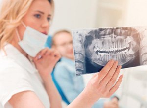 Dentist showing a patient his X-ray