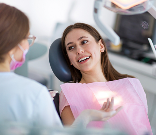 Female dental patient looking at dentist