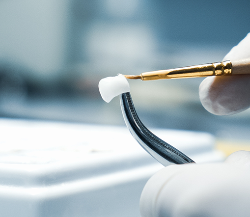 Close up of technician working on dental crown