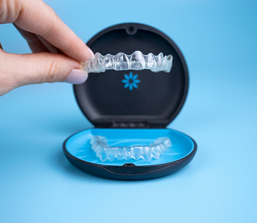 Taking Invisalign aligner out of its case