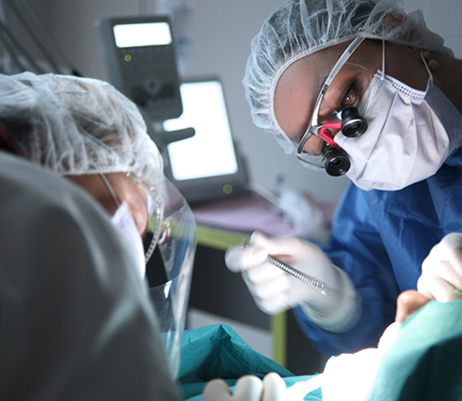 Dentists with masks performing full mouth reconstruction