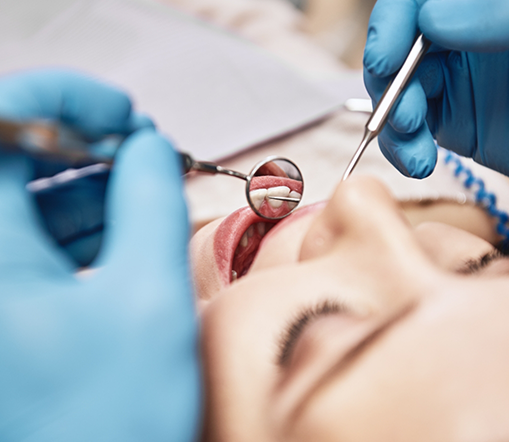 Close up of woman having her teeth examined during checkup