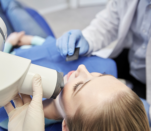 Close up of patient having dental x-ray taken