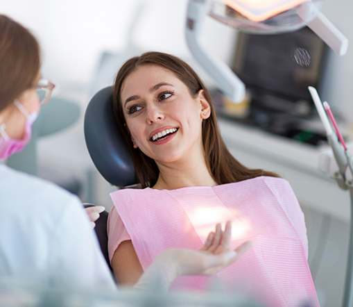 Female patient smiling in dental chair