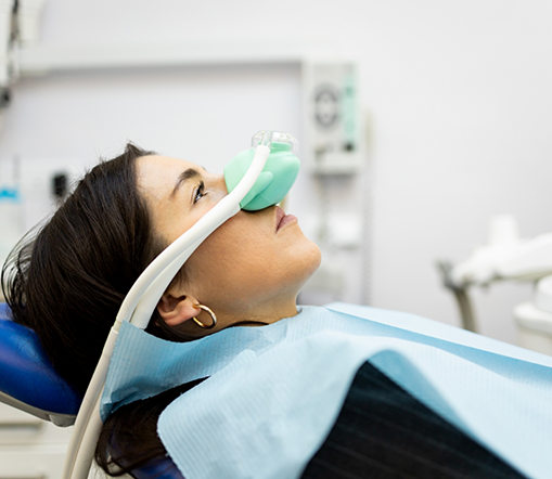 Little boy in dental chair receiving nitrous oxide sedation